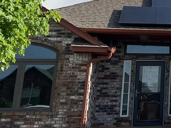 New brown gutters installed on home